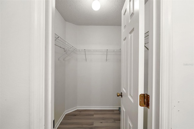 2788 Privada Dr, The Villages, FL 32162 - spacious closet featuring wood finished floors