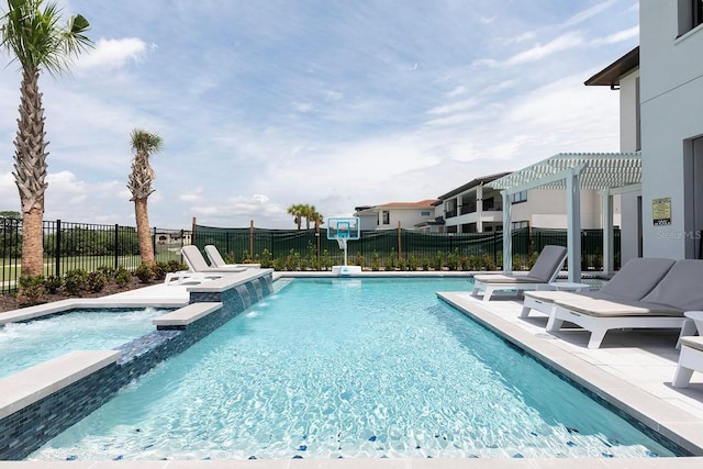 view of swimming pool with a patio, a pergola, a jacuzzi, and pool water feature