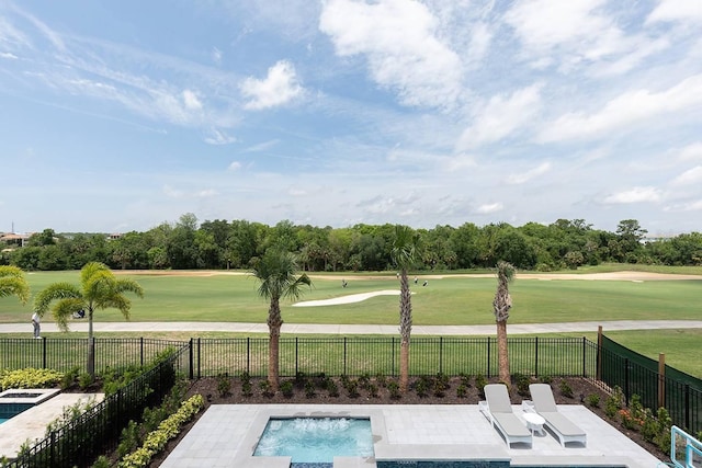 view of swimming pool featuring a patio and a yard