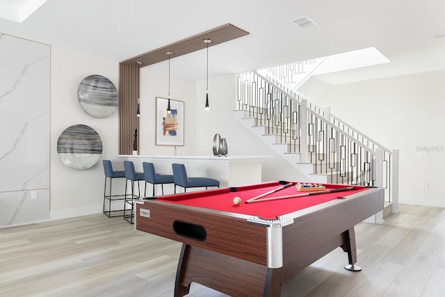 playroom with pool table and light hardwood / wood-style floors