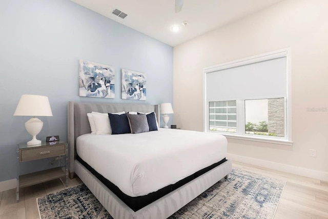 bedroom with hardwood / wood-style floors and ceiling fan