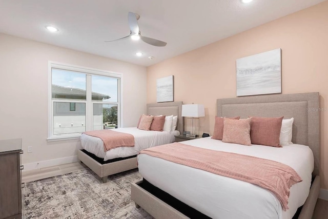 bedroom featuring ceiling fan and light hardwood / wood-style flooring