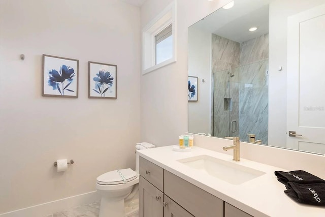 bathroom featuring a shower with door, vanity, and toilet