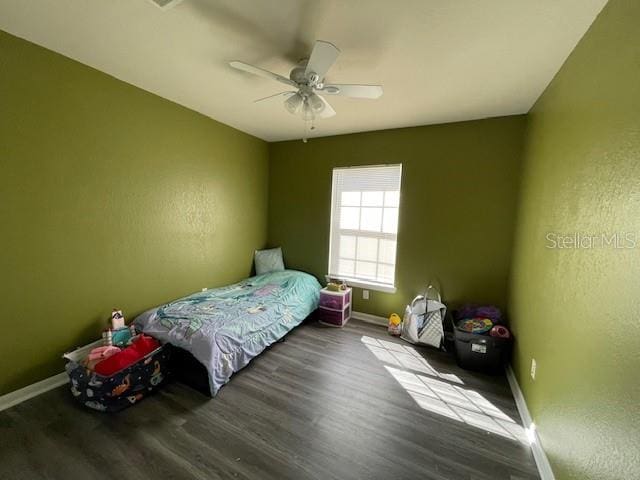 bedroom featuring ceiling fan and hardwood / wood-style flooring