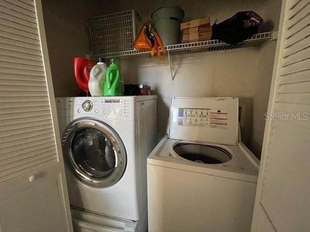 laundry room with washer and clothes dryer