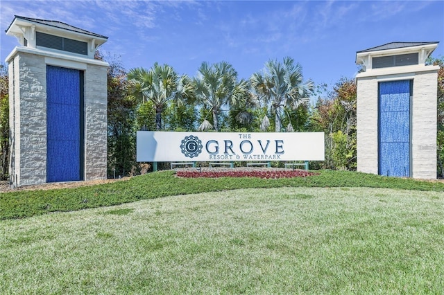 community / neighborhood sign with a lawn