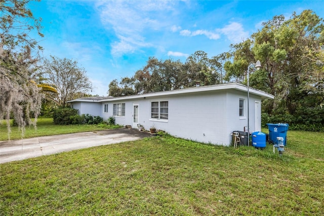 ranch-style house with a front lawn