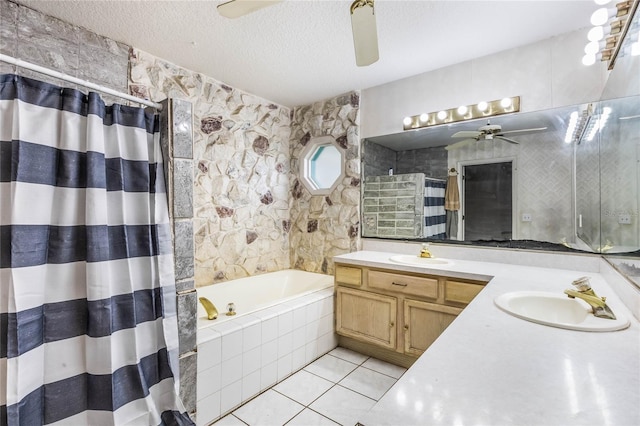 bathroom with vanity, tile patterned floors, shower with separate bathtub, and a textured ceiling