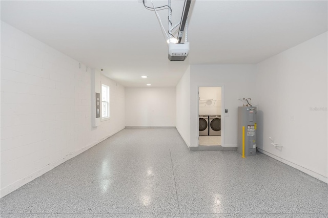 garage with electric panel, a garage door opener, washer and dryer, and water heater