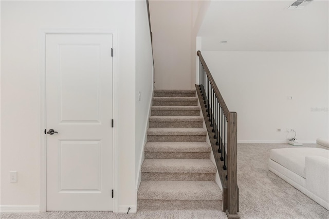 staircase with carpet