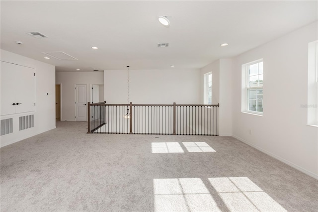 empty room with light colored carpet