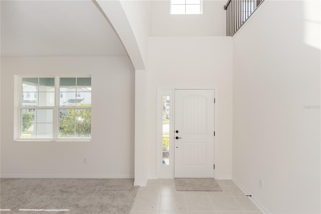 5648 Green Arrow Pl, Sanford, FL 32773 - foyer with arched walkways, healthy amount of natural light, baseboards, and a high ceiling