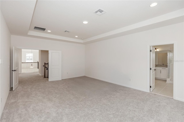 5648 Green Arrow Pl, Sanford, FL 32773 - unfurnished bedroom with light colored carpet, a raised ceiling, baseboards, and recessed lighting