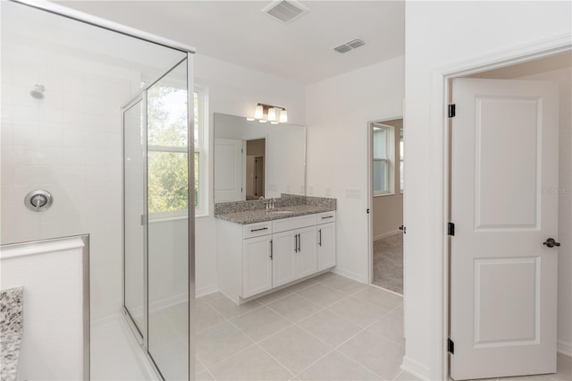 5648 Green Arrow Pl, Sanford, FL 32773 - full bath featuring a stall shower, tile patterned flooring, vanity, and baseboards