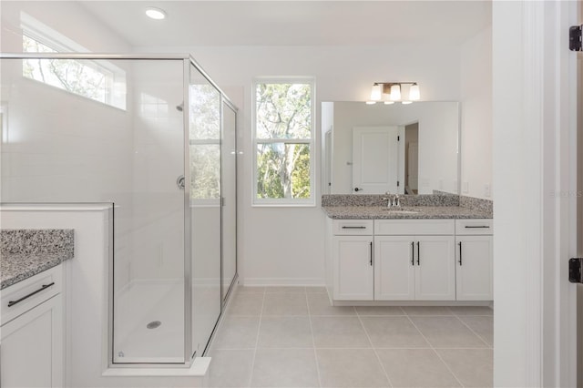 5648 Green Arrow Pl, Sanford, FL 32773 - full bath with tile patterned floors, a shower stall, vanity, and baseboards