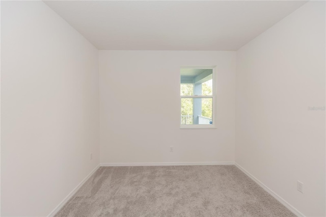 5648 Green Arrow Pl, Sanford, FL 32773 - empty room featuring light carpet and baseboards