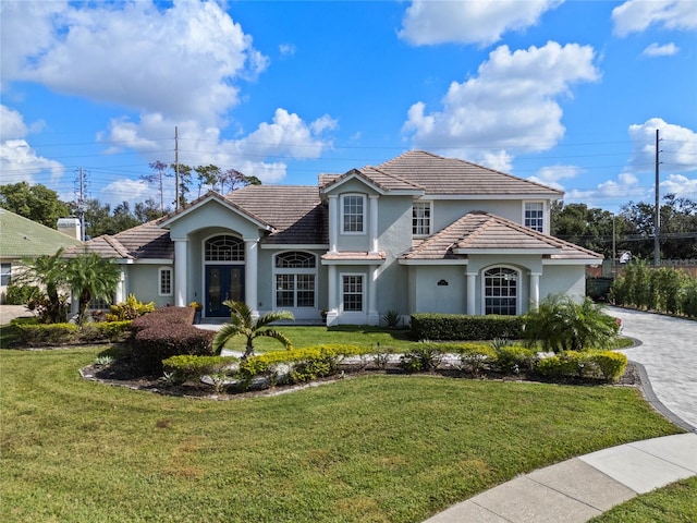 view of front of property featuring french doors and a front yard