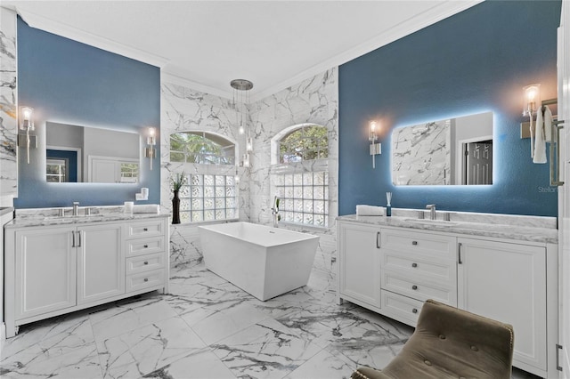 bathroom featuring a bath, vanity, and crown molding