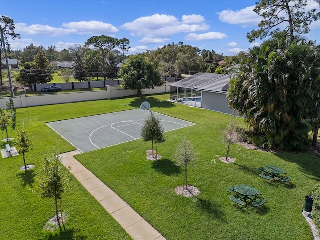 view of sport court featuring a yard