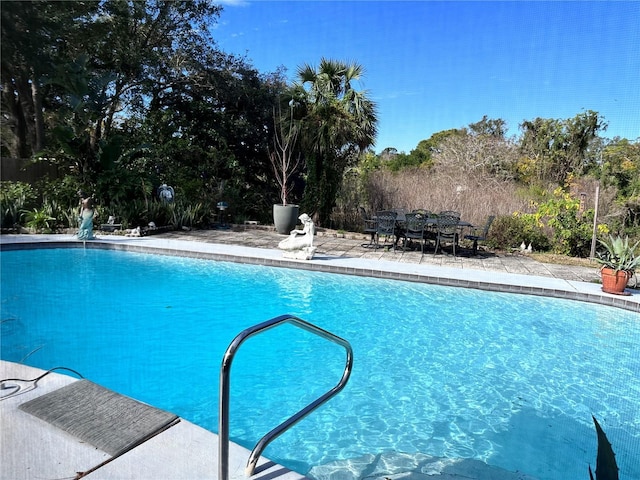 view of pool featuring pool water feature