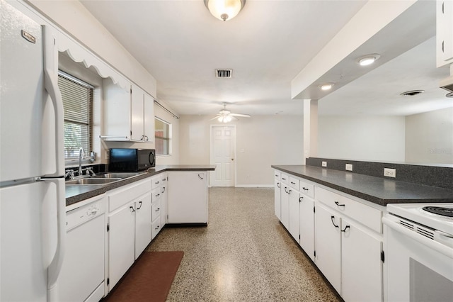 kitchen featuring white cabinetry, kitchen peninsula, sink, and white appliances