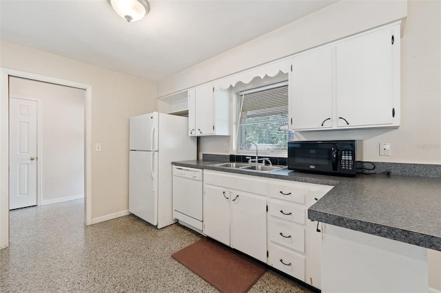 kitchen with white appliances, white cabinetry, and sink