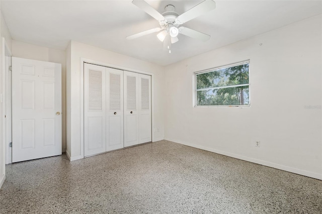 unfurnished bedroom featuring ceiling fan and a closet