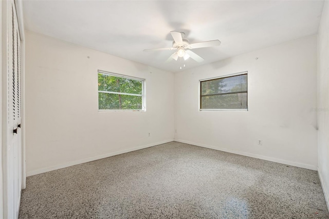 unfurnished room featuring ceiling fan