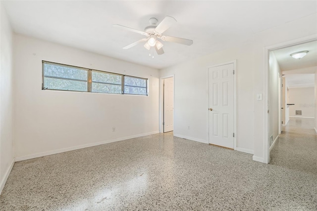 spare room with ceiling fan