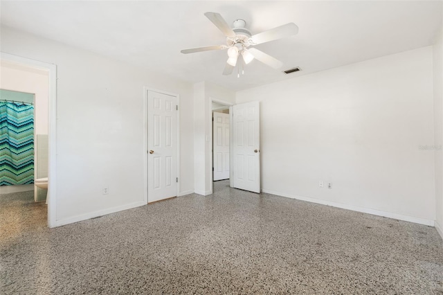 unfurnished bedroom with ceiling fan, connected bathroom, and a closet