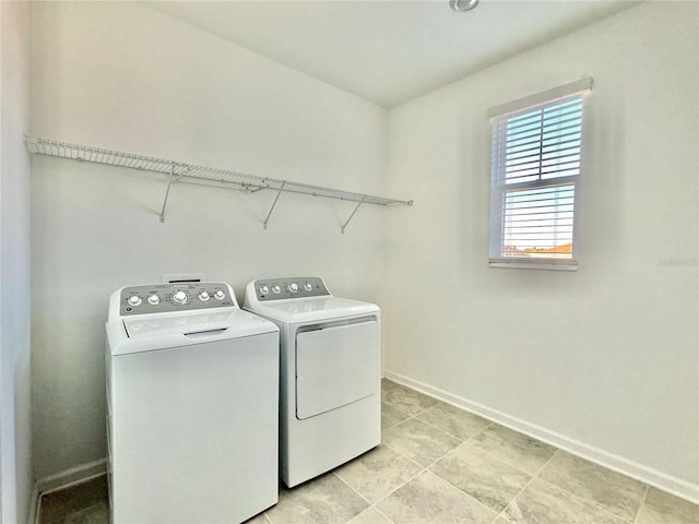 clothes washing area featuring independent washer and dryer