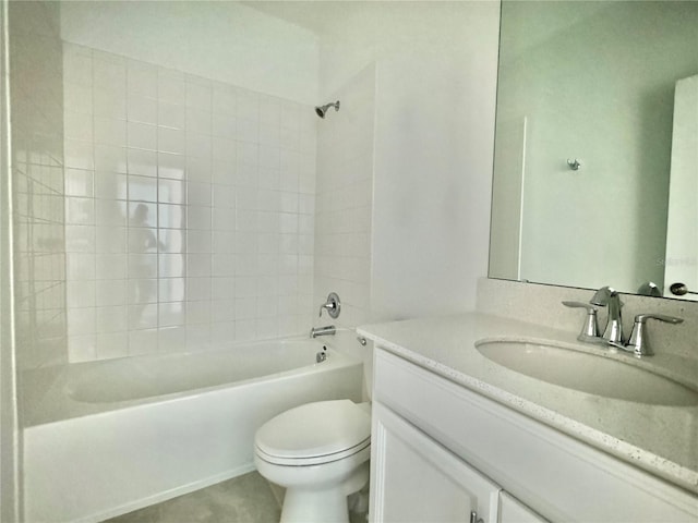 full bathroom with vanity, toilet, and tiled shower / bath