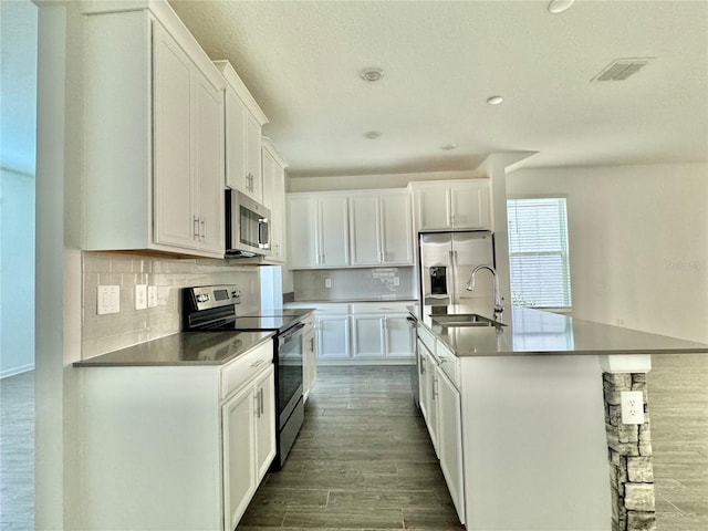 kitchen featuring white cabinetry, sink, and appliances with stainless steel finishes