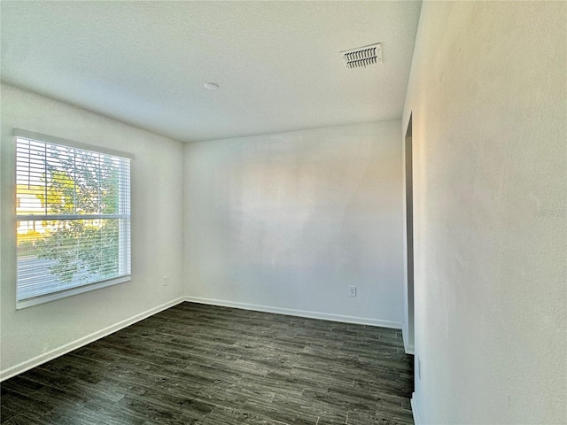 empty room featuring dark hardwood / wood-style floors