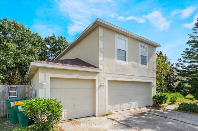 view of side of home with a garage