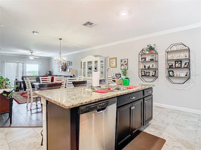 kitchen with light stone countertops, dishwasher, crown molding, decorative light fixtures, and a kitchen island with sink