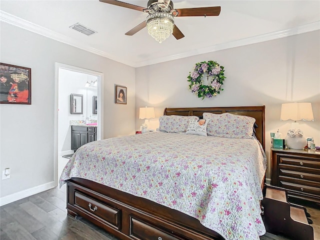 bedroom featuring ceiling fan, ornamental molding, dark wood-type flooring, and ensuite bath