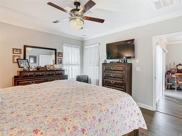 bedroom with ceiling fan, dark wood-type flooring, and ornamental molding