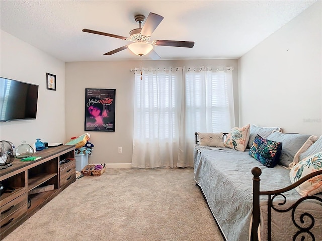 bedroom featuring ceiling fan and light colored carpet