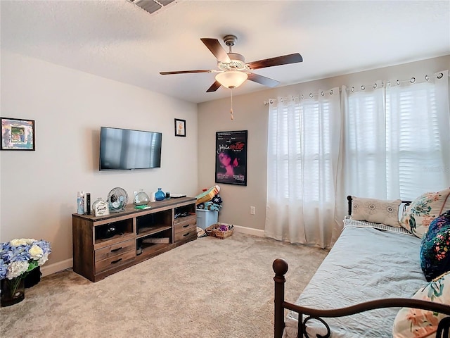 carpeted living room featuring ceiling fan