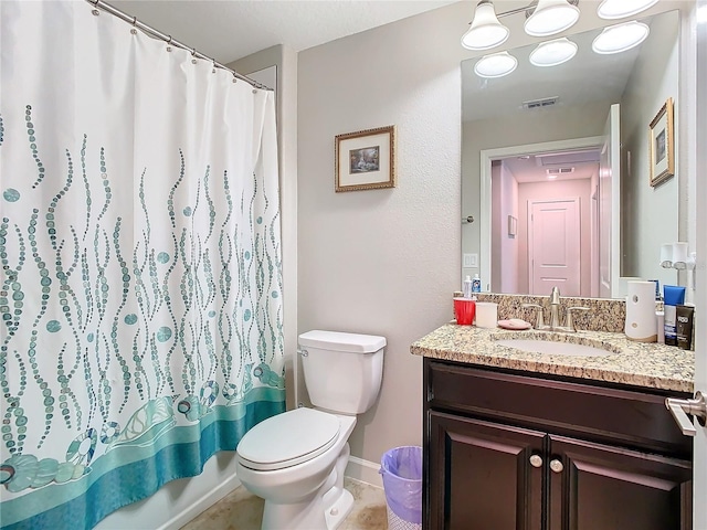 full bathroom featuring tile patterned flooring, shower / tub combo, vanity, and toilet