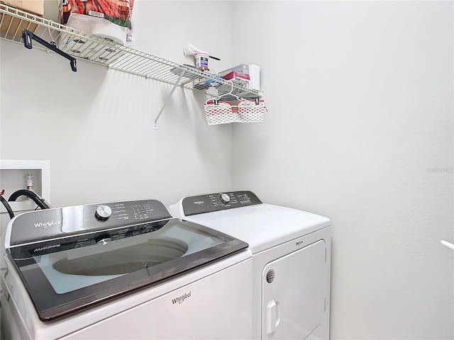 laundry area featuring washing machine and clothes dryer