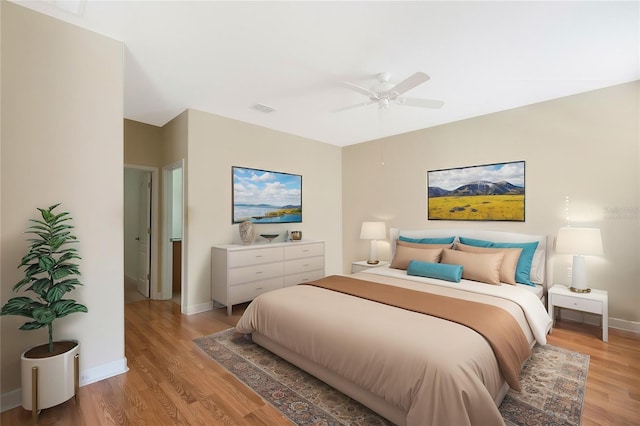 bedroom with ceiling fan and wood-type flooring