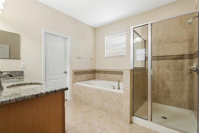 bathroom with tile patterned flooring, plus walk in shower, and vanity