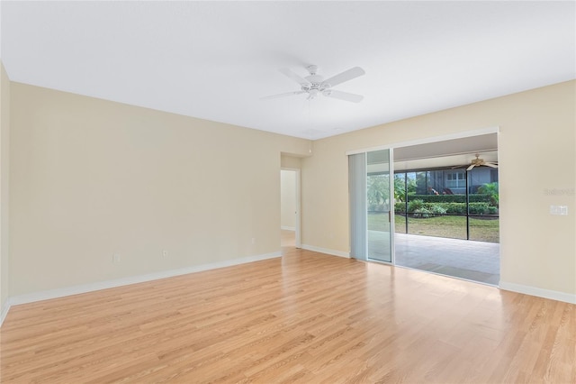 empty room featuring ceiling fan and light wood-type flooring