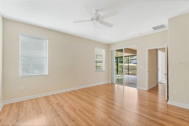 spare room with light hardwood / wood-style floors and ceiling fan