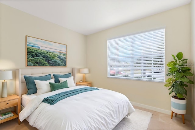 bedroom featuring light colored carpet