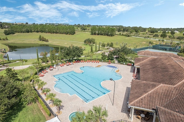 view of pool with a water view and a patio area