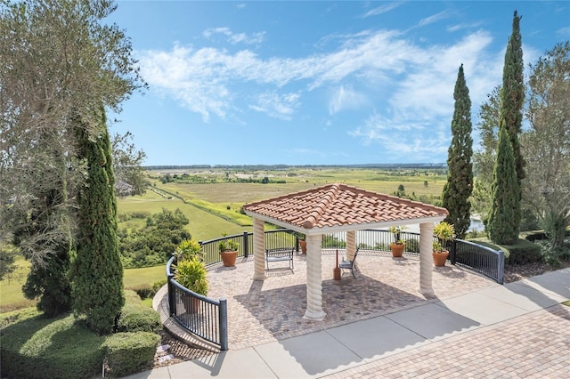 view of community featuring a gazebo and a rural view