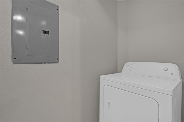 washroom with laundry area, washer / clothes dryer, and electric panel